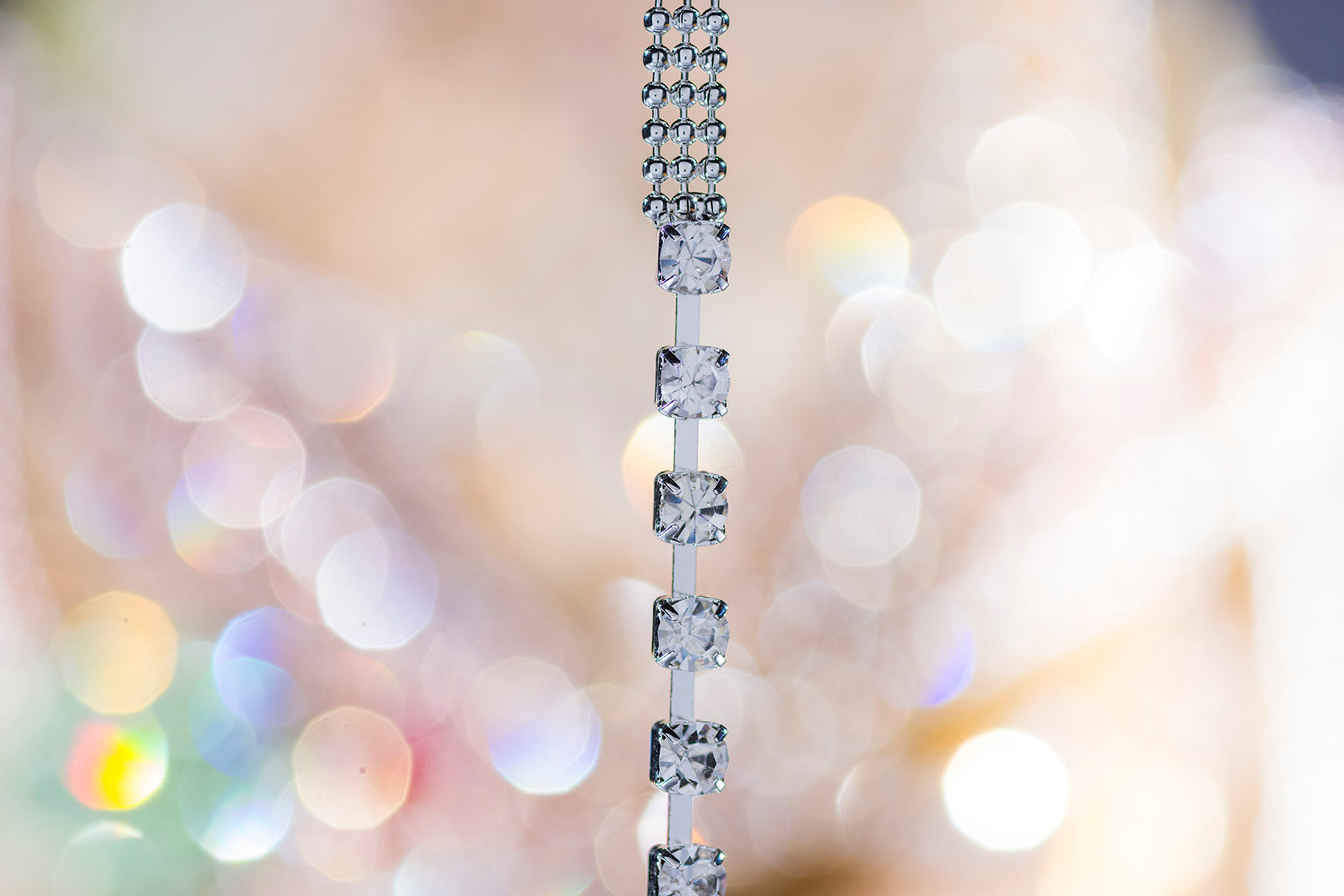 close up silver bra straps with crystals