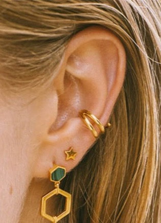 gold earmuff on model