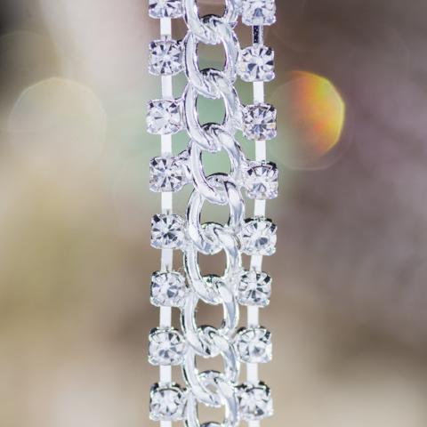 silver bra straps with a chain in the middle