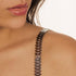 dark silver shiny bra straps on medium skin